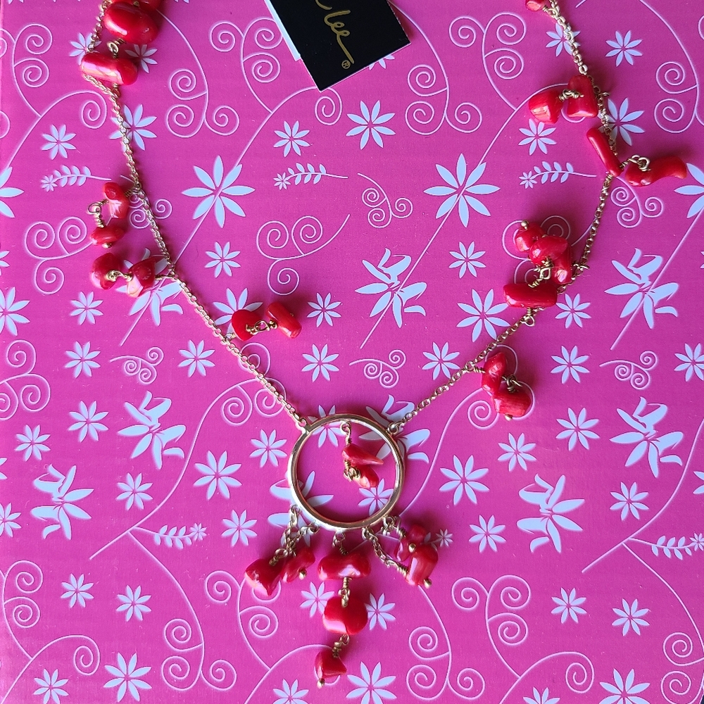 Gold chain necklace with coral stone bead accents